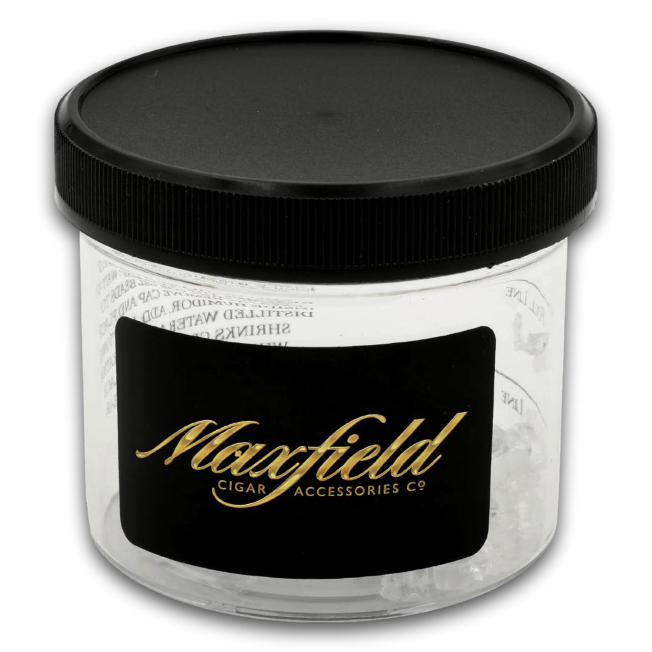 Clear container with black lid and Maxfield Cigar Accessories Co. label on a white background
