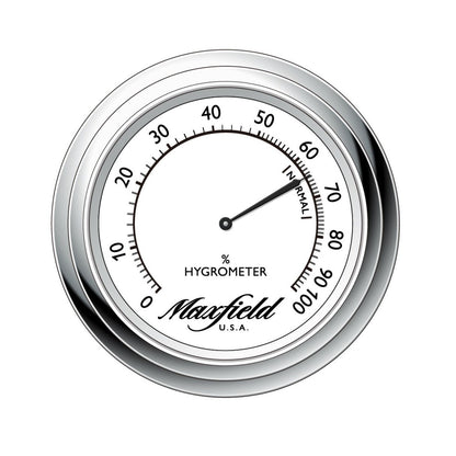 Maxfield hygrometer with silver rim on a white background