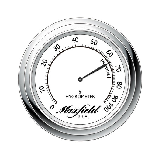 Maxfield hygrometer with silver rim on a white background