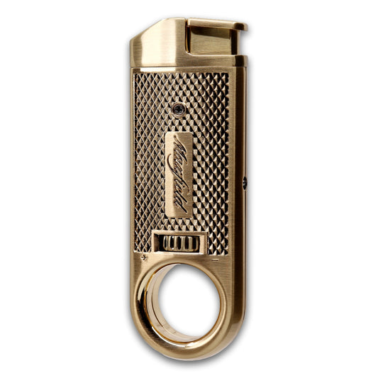 A gold metal Maxfield torch lighter cigar with a textured grip, and a circular finger ring at the bottom, shown on a plain white background.