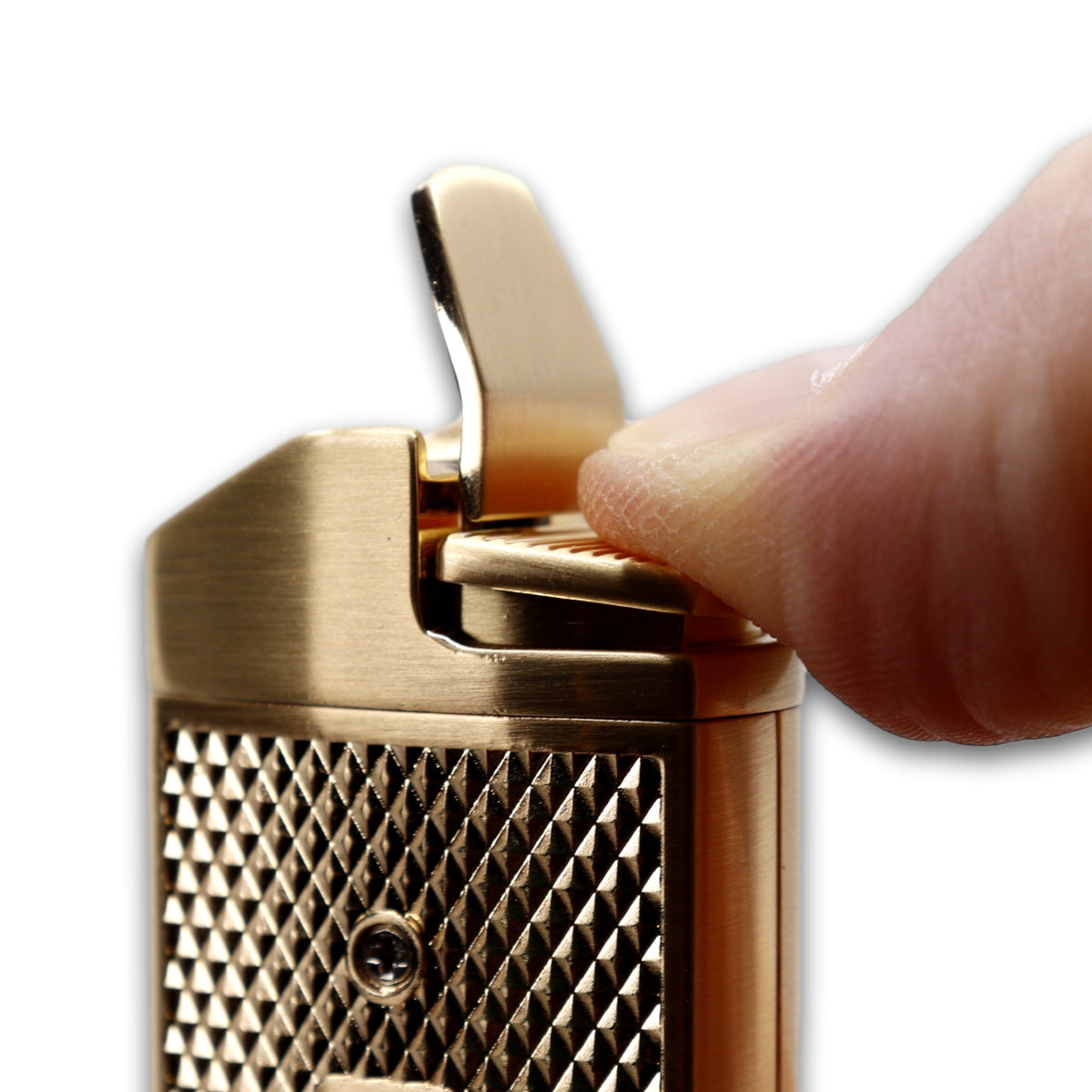 The Maxfield torch lighter ignition button being prsesed down.