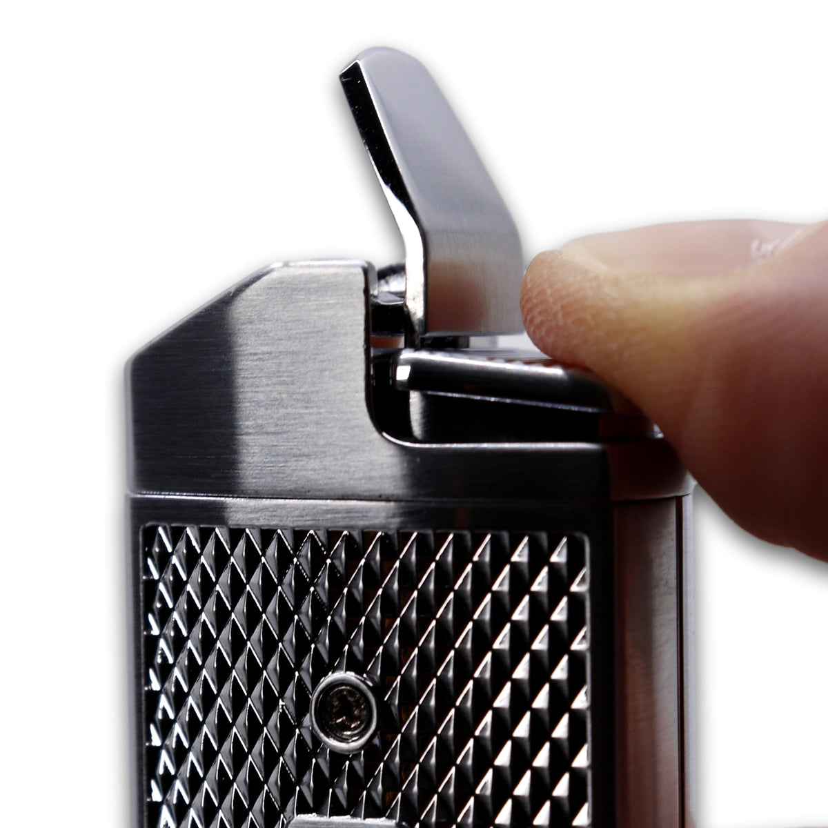 The Maxfield torch lighter igniter button being pressed down.